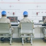 workers in control room - Energy