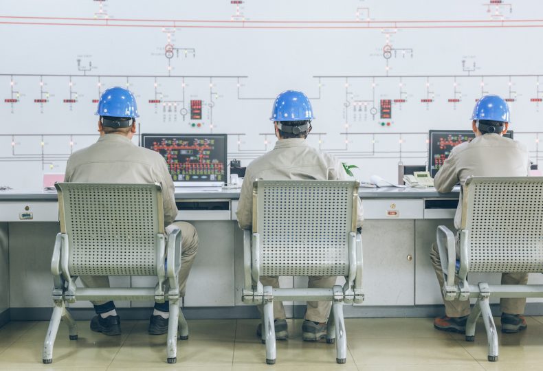 workers in control room - Energy